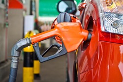 Closeup of a fueling hose at a gas station.
