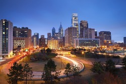 Philadelphia. Image of Philadelphia skyline and busy roads during twilight blue hour.