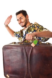 a young, attractive male in a colorful outfit ready to travel as a stereotype tourist