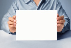 handing a blank business a4 card over in hand