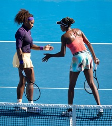 MELBOURNE - JANUARY 22: Venus (R) and Serena Williams of the USA in a doubles match at the 2013 Australian Open on January 22, 2013 in Melbourne, Australia.
