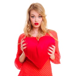 Valentines Day. Woman holding Valentines Day heart sign with copy space. positive portrait blonde