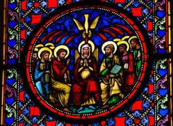 BAYEUX - FEBRUARY 12: Stained Glass window depicting Pentecost, in Bayeux, Calvados, France on February 12, 2013.