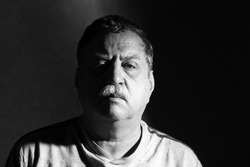 middle-aged man with mustache, black and whiye