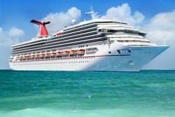 GEORGE TOWN, GRAND CAYMAN ISLAND - FEBRUARY 26: Carnival Cruise Line, cruise ship Carnival Victory Sails from Port George Town on February 26, 2013.