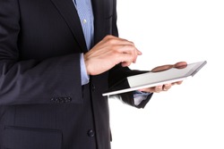 Young businessman's hands working on a tablet pc computer isolated on white