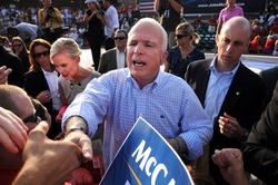 O'FALLON - AUGUST 31: Senator McCain and wife Cindy shake hands with the crowd at rally in O'Fallon near St. Louis, MO on August 31, 2008