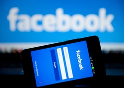 MANCHESTER - JAN 14: Facebook Sign in page on mobile phone on Jan. 14 2014 in Manchester, UK. More than 425 million active users access Facebook through mobile devices in 60 countries.