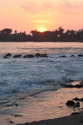 Sunset taken from Alii Drive, Kona, Big Island, Hawaii looking towards the King Kamehameha hotel from Bubba Gumps.