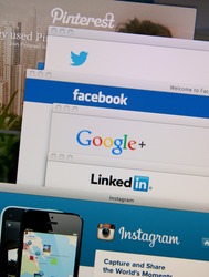 LISBON, PORTUGAL - MARCH 13, 2014: Photo of Pinterest, Twitter, Facebook, Google+, Linkedin and Instagram homepage on a monitor screen. These are popular social networking websites.