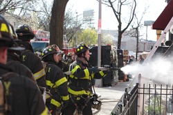 NEW YORK CITY - MAY 1 2014: Several FDNY engine & ladder companies respond to a house fire in the Gowanus neighborhood of Brooklyn.