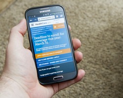 CALDWELL, IDAHO/USA - MARCH 31, 2014: Hand holding a smartphone on the healthcare website