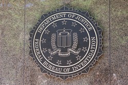 WASHINGTON, DC - JUNE 1: F.B.I. seal located outside the J. Edgar Hoover F.B.I. Building in downtown Washington, DC on June 1, 2014.