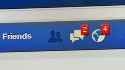 LONDON - AUG 19: Close-up view of Facebook notifications tabs on Aug 19, 2014 in London, UK. Facebook is the world's largest online social network services with reportedly 1.28 billion active users.