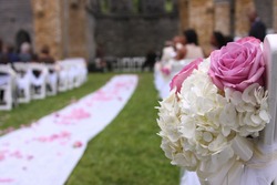 Wedding aisle and bouquet with unidentifiable guest