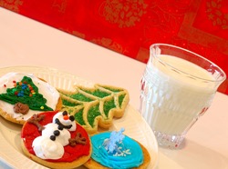 Christmas Cookies - A plate of decorated holiday cookies against a cheerful happy holidays background.