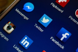 BANGKOK-JANUARY11 2015: Twitter Icon on Phone. Twitter is an online social networking service that enables users to send and read short 140-character messages called "tweets".