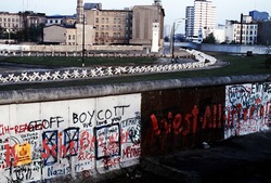 The Berlin Wall separated Communist-controlled East Germany from West Berlin. White apartments of West Berlin contrast with the boarded up vacant brick buildings of East Berlin. June 1 1983.