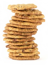 Tall uneven stack of homemade chocolate chip cookies isolated on white background.