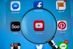 BANGKOK-FEBRUARY 25 2015: Magnifying Youtube Icon on Tablet. YouTube is a video-sharing website headquartered in San Bruno, California.