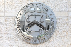 WASHINGTON, DC - DECEMBER 26: Seal of the Office of the Comptroller of the Currency in downtown Washington, DC on December 26, 2014.