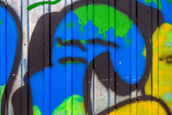 Beautiful street art graffiti. Abstract creative drawing fashion colors on the walls of the city. Urban Contemporary Culture