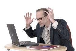 Workaholic, Disapointed, angry businessman, boss working on laptop. Business, corporate concept.