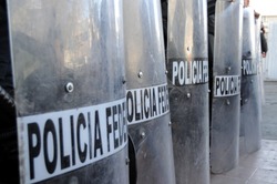 Shields of Mexican federal police forces maintaining order in the violent border city of Ciudad Juarez