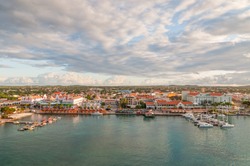ORANJESTAD, ARUBA - December 1: A view of Oranjestad, capital of Aruba. Small boats and yachts are moored to the jetty and white Dutch style buildings are in the middle at December 1, 2011.