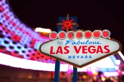 Welcome to Fabulous Las Vegas Neon Sign. Intentional Blurred Las Vegas Strip In Background