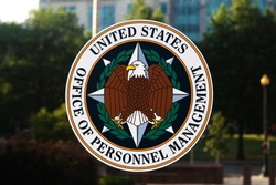 WASHINGTON, DC - JUNE 6: Emblem on the door of the Office of Personnel Management (OPM) in Washington, DC on June 6, 2015. OPM manages the civil service of the federal government.