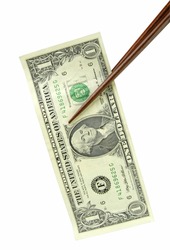 Two chopsticks holding one dollar bill isolated over white background with clipping path.