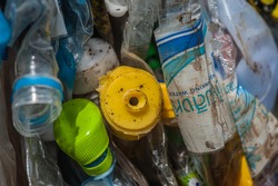 Suratthani,Thailand, May 2,2015: Plastic bottles of various drinks. The waste separation and recycling to get old.