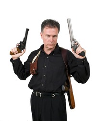 Mature,male wearing a shoulder holster holding a nine millimeter and a 44 magnum.