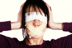 Censor and freedom of speech concept. Media prisoner and human rights concept. Tied mouth and blindfolded eyes.