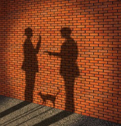 One man threatens with a pistol to other man. (It is made in the form of a shade on a brick wall)