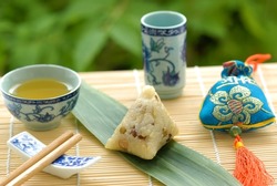 Chinese Glutinous Rice Dumpling(glutinous rice wrapped to form a pyramid using bamboo or reed leaves),People eat this food at Dragon Boat Festival(5th day of the 5th lunar month).