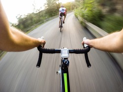 Speed on bike, Couple of cyclist during a road race. Pov, original point of view