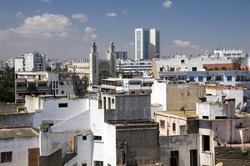 horizontal city skyline view of casablanca morocco with skyscrapers and a mosque with two minarets in africa