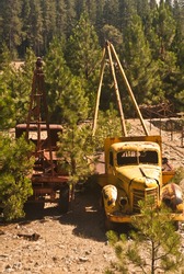 Vintage Trucks with cranes and winches at Empire Mine State History Park in Grass Valley, California