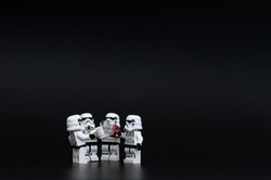 Orvieto, Italy - November 15th 2015: Group of Star Wars Lego Stormtroopers mini figures drunk a beer. Lego is a popular line of construction toys manufactured by the Lego Group