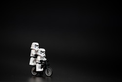 Orvieto, Italy - November 15th 2015: Star Wars Lego Stormtroopers mini figures on bicycle. Lego is a popular line of construction toys manufactured by the Lego Group