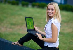 woman with recycle sign on computer