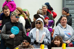 Stamford, CT, USA - November 22, 2015: Spectators enjoying the annual "Thanksgiving Day" parade in downtown Stamford on November 22, 2015.