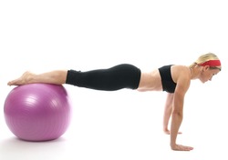 illustration of push ups on fitness core training ball with push up bars by attractive middle age fitness trainer teacher woman exercising and stretching