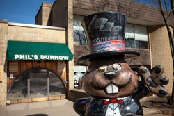 PUNXSUTAWNEY, PA MARCH 29: Statue of Punxsutawney Phil in front of Phils Burrow in downtown Punxsutawney, PA on March 29, 2015.