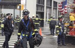 NEW YORK CITY - FEBRUARY 5 2016: A crawler crane in the process of being secured against high winds collapsed on Worth St, injuring several & killing one person.
