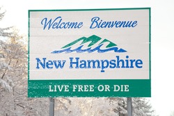 NASHUA, NH FEBRUARY 5: Welcome sign for New Hampshire is covered with fresh fallen snow on February 5, 2016 in Nashua, NH. A Donald Trump campaign event was canceled due to the snow storm.