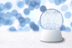 Empty Christmas Snow Globe With Blue Background. Insert Your Own Image or Text