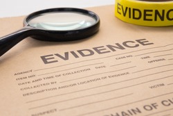 magnifying glass and evidence bag for detective and crime scene investigation